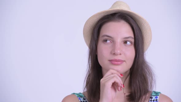 Face of Happy Young Beautiful Tourist Woman Thinking