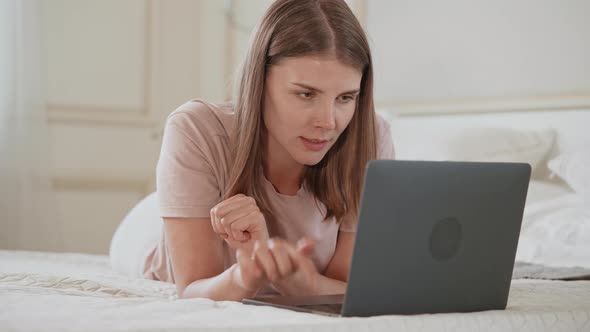 Jolly Female Use Computer in Apartment