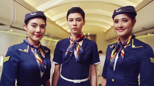 Cabin Crew Clapping Hands in Airplane