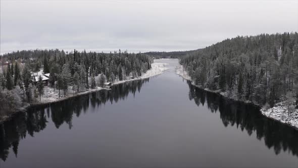 A DRONE FOOTAGE OF A LAKE AFTER SNOWFALL