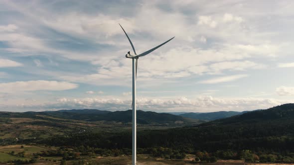 Camera Flight Over Landscape with Power Plant. Aerial View To Wind Turbine. Sustainable Electricity