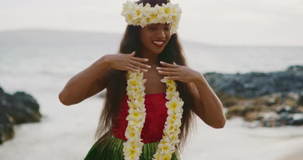 Woman performing Hawaiian hula on the beach