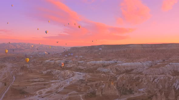 Aerial Drone View Pink Dawn in Cappadocia in the Rose Valley with Views of the Hills and Colorful