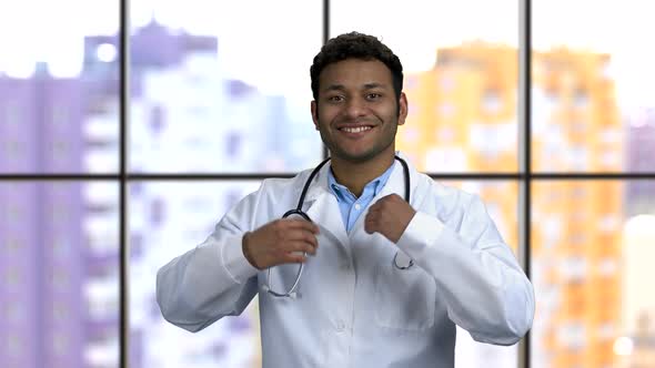 Young Darkskinned Doctor Puts on Stethoscope