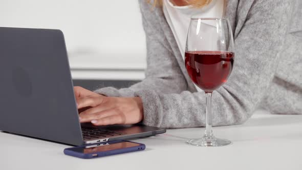 Unrecognizable Woman Using Computer at Home