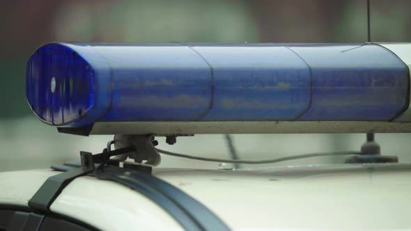 Flashing Flasher on the Roof of a Police Car. Blinker. Close-up.