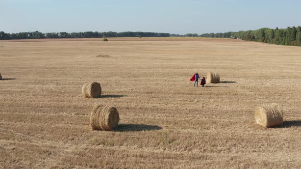 Aerial Shot of Dad and Son Playing on Field