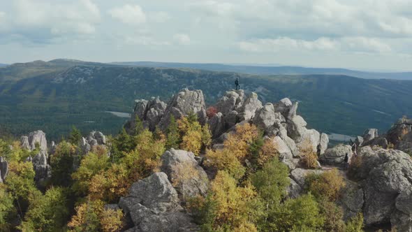 A Man on Top of a Mountain