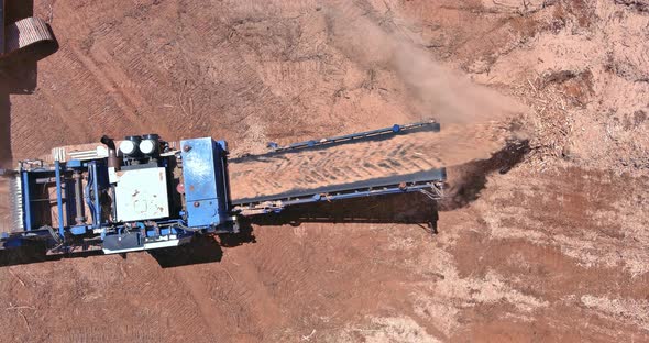 Stationary Industrial Wood Shredder an Excavator Works on Deforestation Forestry