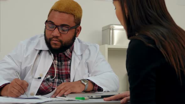 Male Doctor Signing Medical Paper in Exchange for Female Patient Money