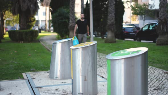 People Dispose of Metal Plastic Glass and Paper Wastes with Garbage Sorting