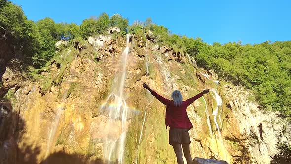 Girl Looking Waterfall in Plitvice Lakes National Park