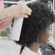 Hairdresser Fixing African American Woman Curly Hair in Beauty Salon - VideoHive Item for Sale