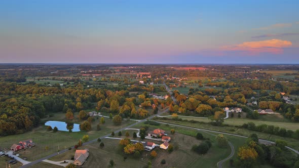 Colorful Summer Landscape with Field Under Scenic Small Village in Sunset Dawn Skyline on Akron Ohio