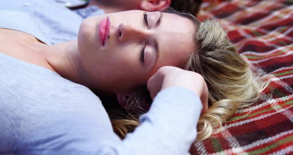 Close-up of beautiful woman relaxing in vineyard