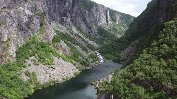 Spectacular aerial in remote valley Maboedalen valley leading up to Hardangervidda national park - R