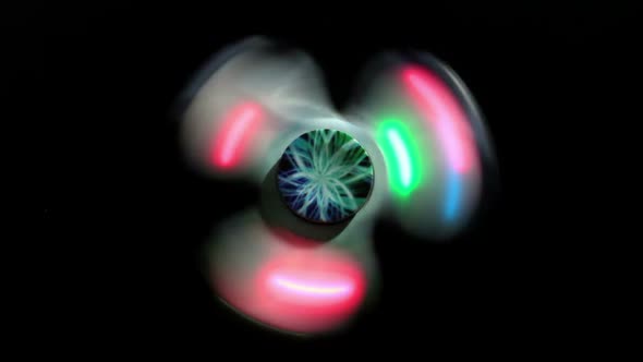 Glowing Spinner Spins On A Black Background 1