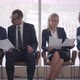 Diverse Business People Sit in Business Center Waiting Room and Discuss Document - VideoHive Item for Sale