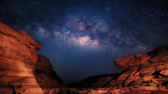 4K Time lapse of milky way and sunrise over Sam Pan Bok canyon, Ubon ratchathani, Thailand 