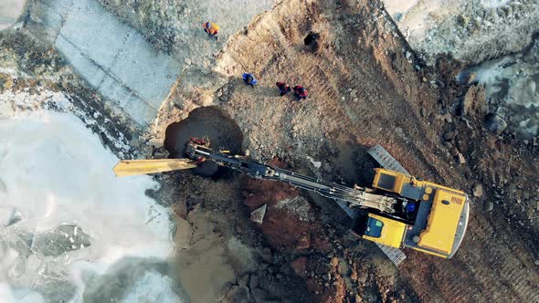 Metal Beam Is Getting Installed at the Quarry Site By the Excavator Building Construction Process