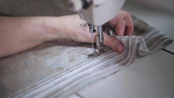 Sew a dress in a textile factory