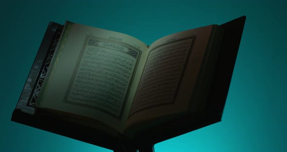 Holy Quran On Book Rest Rotation Partial Light