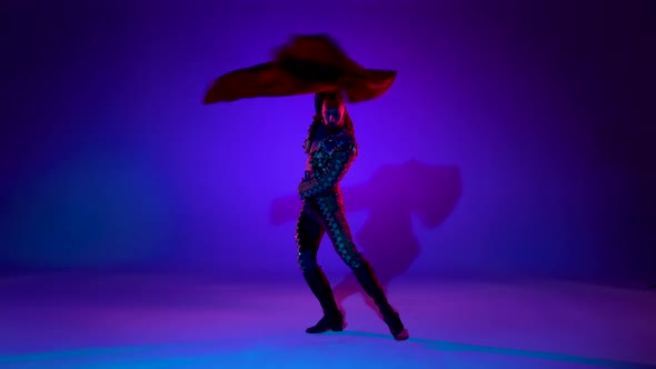 Torero in Blue and Gold Suit or Typical Spanish Bullfighter Isolated Over on a Blue Background.