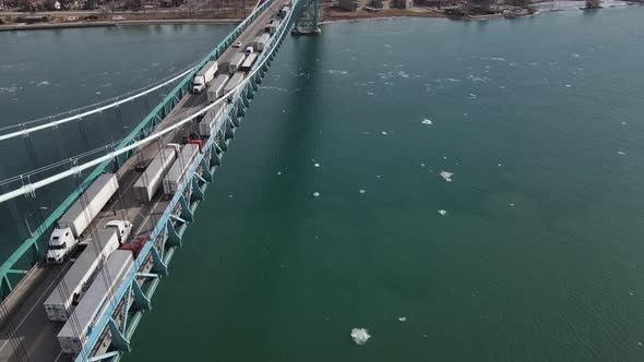 Traffic jam of semi-trucks on Ambassador bridge. Crossing USA - Canada border. Aerial view