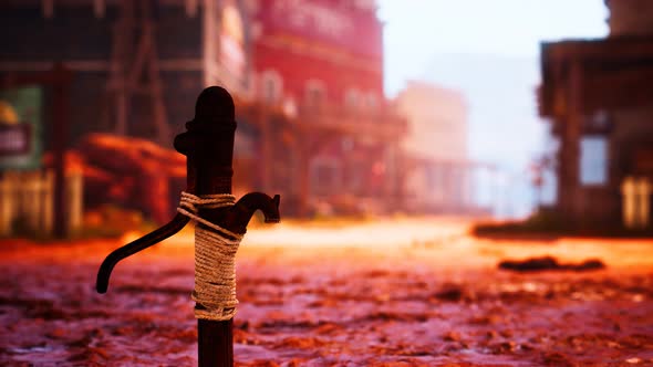 Old Rusted Water Pump in Wild West Town alt