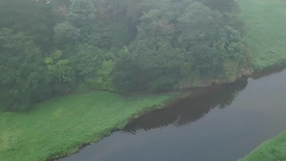 Close up from above of the River Otter with its lushes greenery and nature. The south stream hold ma