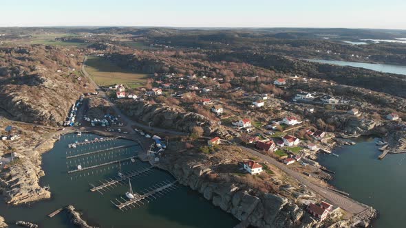 Flying Towards Rural Coastal Village and Empty Marina Aerial