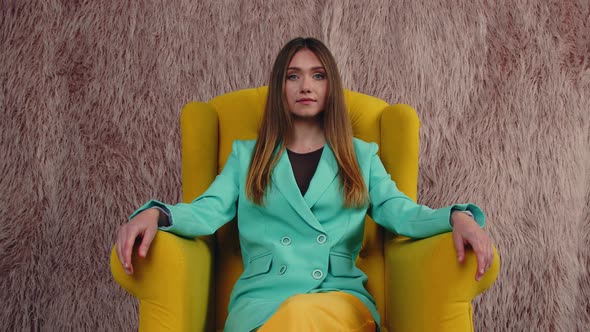 Bossy Lady Is Sitting In Armchair