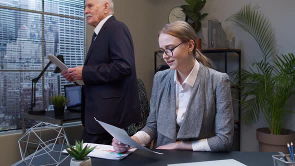 Displeased Upset Young Businesswoman Accountant Reading Documents Analyzing Financial Papers Data