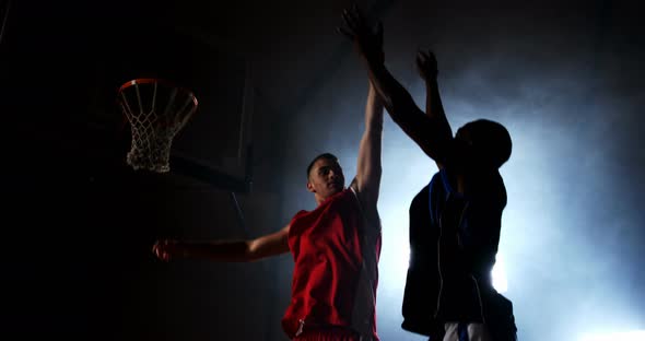 Sportsmen playing basketball