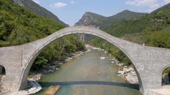 Beautiful River, Mountains and Ancient stone Bridge