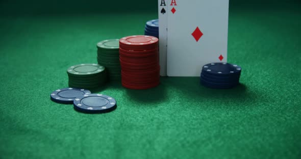 Playing cards and casino chips on poker table 4k