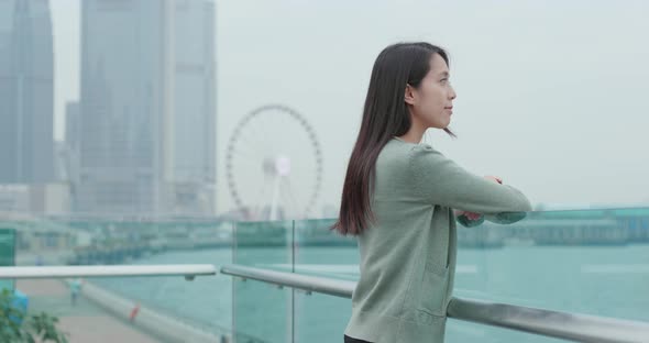 Woman looking at city of Hong Kong