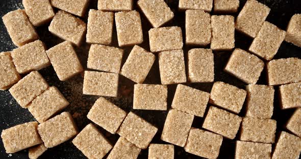 The Brown Cane Sugar Cubes Rotate Slowly