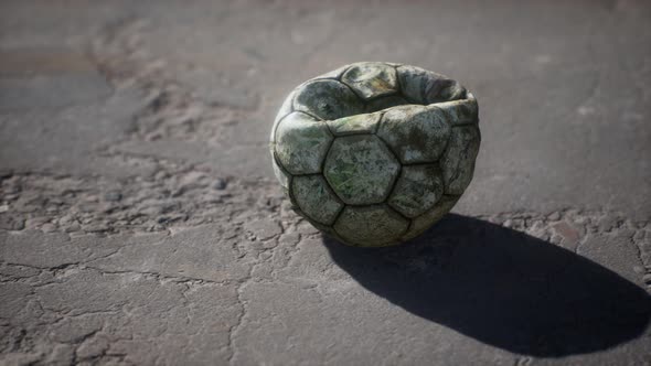 Old Soccer Ball the Cement Floor alt