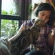 Lovely Asian girl feeding group of kitten cat with cat food. - VideoHive Item for Sale