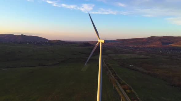 384 Z 8Wind turbine rotation close up at sunset on beautiful landscape