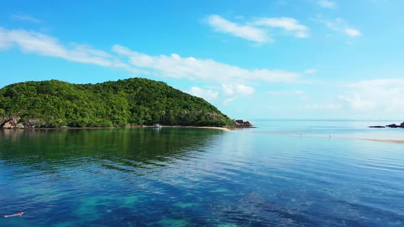 Aerial drone shot panorama of luxury lagoon beach trip by clear ocean with white sand background of 