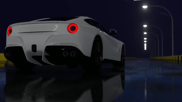 White Luxury Sports Car Driving on Empty Road at Night alt