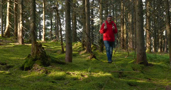 Tourist Guy with Backpack Hiking on an Adventure Trip in Natural Landscape