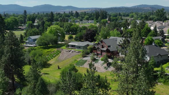Tight aerial shot of the million dollar mansions along the Spokane River.