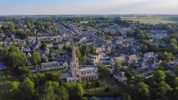 Aerial Drone View of Cotswolds Village and Burford Church in England, a Popular English Picturesque