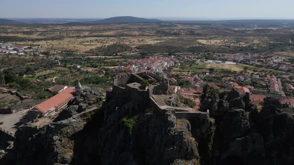 Ruins of Penha Garcia castle and surrounding landscape, Portugal. Aerial forward