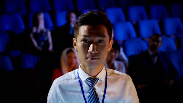 Young Asian businessman attending business seminar in auditorium 4k