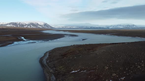 Flying Up From the River with Glaciers in the Background