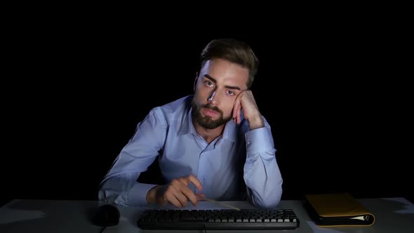 Man Waiting with Indifference To Download the File. Dark Studio